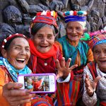 Four ladies in their native attire taking a groufie